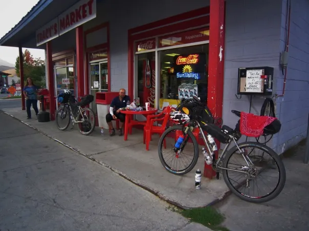 Loaded bikepacking bicycles outside a small Idaho market